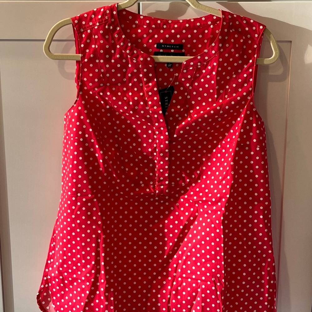 Pink polka dot sleeveless blouse